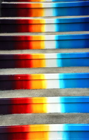 Concrete steps painted colors of the rainbow, climb heavenward.  の写真素材