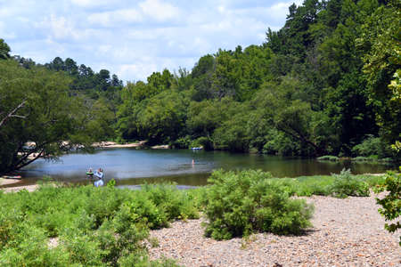 The Caddo River serves as one of Arkansas' recreation areas.  This area is near Glenwood, Arkansas.  Water enthusiasts wade and swim.の写真素材