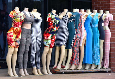 Mannequins model clothing outside a strip mall in Memphis, Tennessee.  Mannequins are headless and barefoot.の写真素材