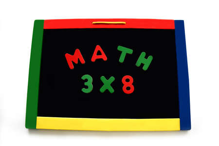 Wooden letters spell math and a multiplication problem on a magnetic board.  Board is rimmed with...