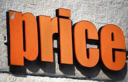 One word, price, illustrates the shopping experience.  Orange letters have ribbed surface.の写真素材