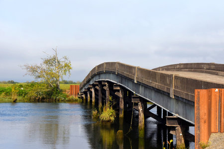 Small bridge crosses over the Columbia River giving access to Svensen Island, in Oregon.の写真素材