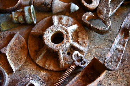 Dusty tool box has collection of antique mining tools and miscellaneous steel.  Everything is dusty,...