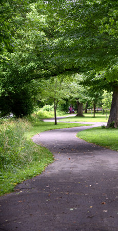 Curving sidewalk, in Riverfront Park, Kingsport, Tennessee, runs along the South Branch of the...