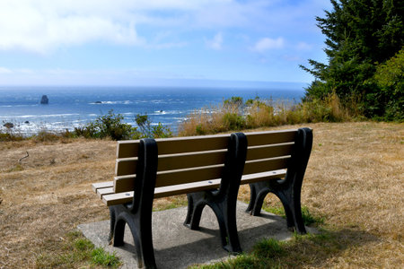 Cape Ferrelo Viewpoint, along Oregon's Highway 101, gives beautiful vista of ocean and sea stacks.  Bench is available for resting and viewing.の写真素材