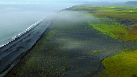 Black volcanic sandy beach in Icelandの写真素材