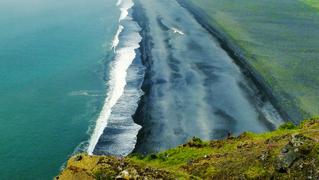 Black volcanic sandy beach in Icelandの写真素材