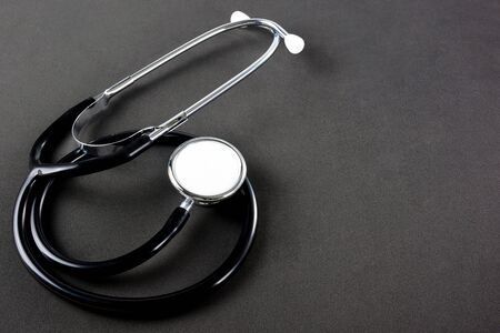 Close up stethoscope on black background.の写真素材