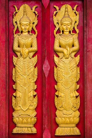 Pattern in traditional Thai style art painting on door of the templeの写真素材