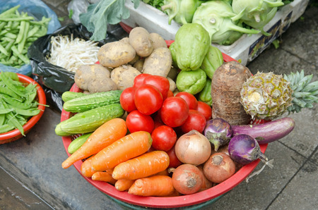 Assorted vegetables for sale on a street in Vietnamの写真素材