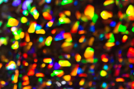 Multicolored glowing abstract blurred background. Glitter bokehの写真素材