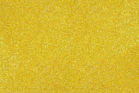 Yellow, golden abstract blured background with shimmer, glitter and shine. Merry Christmas or new year bokeh. Saint Valentine day card. Copy spaceの写真素材