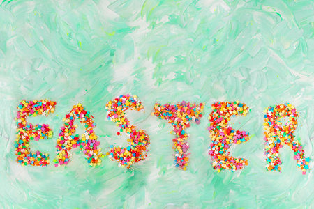 Easter text on green background with brush strokes. Spring card. Copy spaceの写真素材