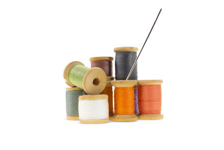 Wooden bobbins for gray, orange, burgundy, purple threads on white isolated background. Handmade,...