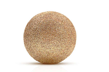 Golden festive shiny ball with shimmer on white isolated background. Design element. Christmas, New Year, holidayの写真素材