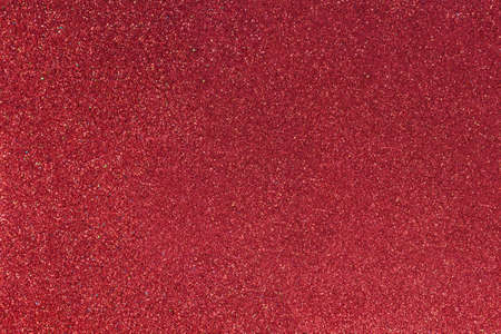 Red abstract blured background with shimmer, glitter and shine. Merry Christmas or new year bokeh. Saint Valentine day card. Copy spaceの写真素材