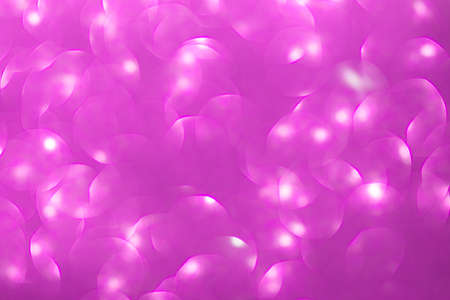 Pink defocused light. Bokeh background with highlights. Christmas, New Year, Valentine's Day. Copy spaceの写真素材