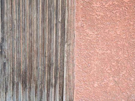 Two textures. Wooden gray slats and beige decorative plaster, texture. copy spaceの写真素材