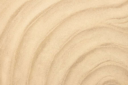 Yellow wavy sea sandy beach. Concept of summer, vacation, holiday background. copy spaceの写真素材