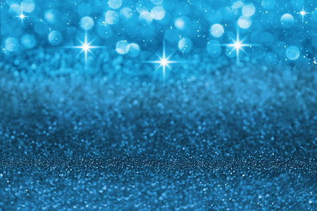 Blue defocused shiny with stars and glitter, shimmer and sparkle background. Christmas, New Year. copy spaceの写真素材