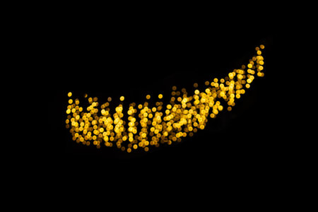 Defocused yellow lights on black isolated background. design element. Christmas, New Year, holiday. copy spaceの写真素材
