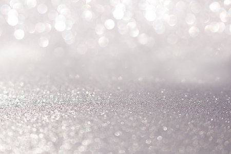 Blurred silver glitter background with sparkle. Christmas, New Year, March 8, birthday,...