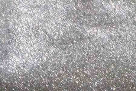 Shiny silver defocused holiday background with sparkle. Christmas, New Year, Birthday. copy spaceの写真素材