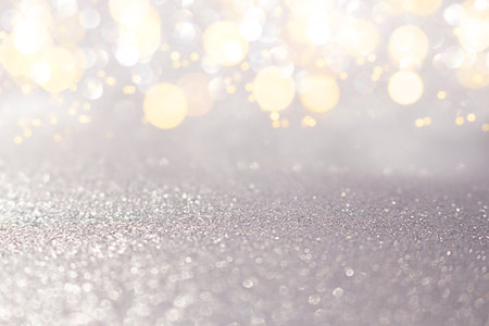 Blurred silver with yellow defocused background with sparkle. Christmas, New Year, March 8,...