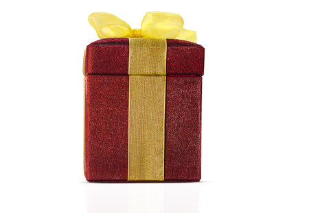 Red shiny box with yellow bow. Straight view on white isolated background. design element. Festive surpriseの写真素材