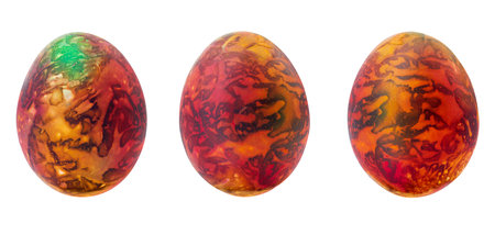 Collection of abstract orange - brown - green drawings on painted eggs. Easter concept, fantasy animal eggs. copy spaceの写真素材