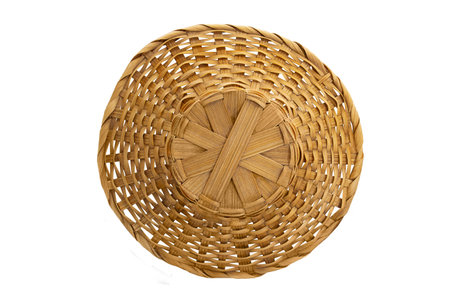 Woven straw country hat for beach, fields on white isolated background. vacation, travel. View from aboveの写真素材