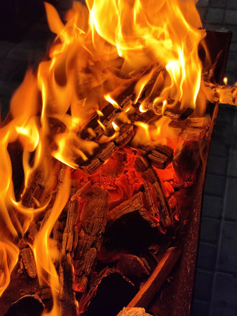 Charcoal with wood firebrands for barbecue. Background with flamesの写真素材