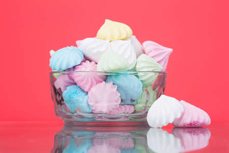 Zephyr in a glass bowl on coral backgroundの写真素材