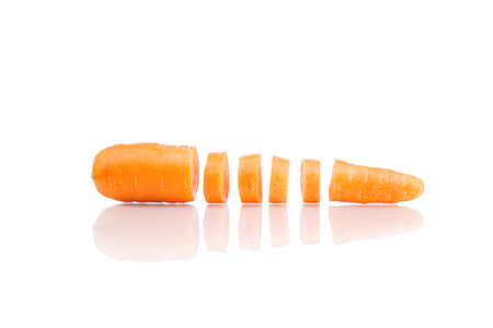 Sliced carrot isolated on whiteの写真素材