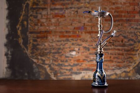 Eastern hookah on wood table