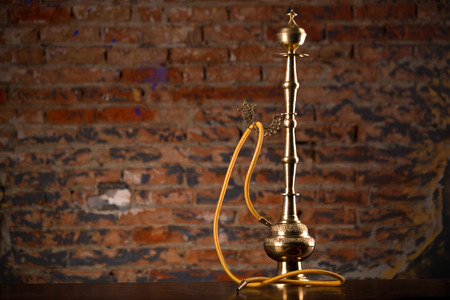 Eastern hookah on wood tableの写真素材