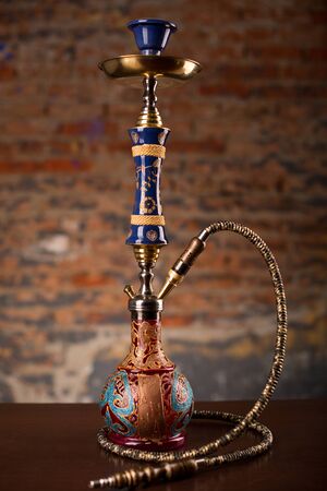 Eastern hookah on wood tableの写真素材