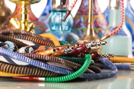 Group of eastern hookahs on white background