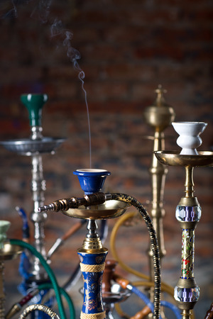 group of eastern hookahs on tableの写真素材