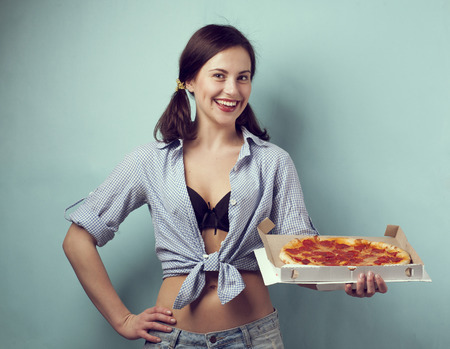 Happy girl with a pizza boxの写真素材