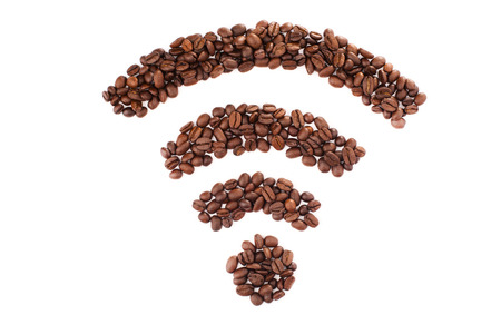 Wi-fi shape made of coffee beans over white backgroundの写真素材
