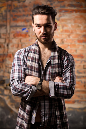 Attractive young guy posing in studioの写真素材