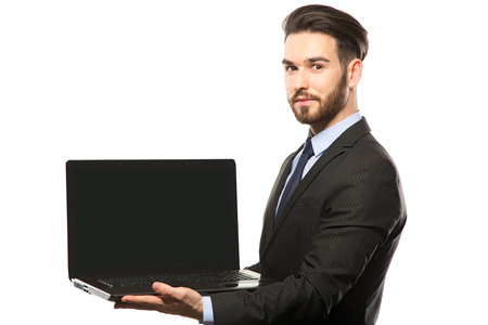 Business man with a laptop - isolated over a white backgroundの写真素材