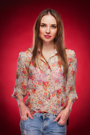 photo of a Caucasian model on red backgroundの写真素材