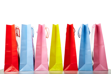 Colourful paper shopping bags isolated on whiteの写真素材