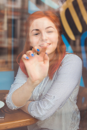 Young Attractive Woman in Cafe.の写真素材