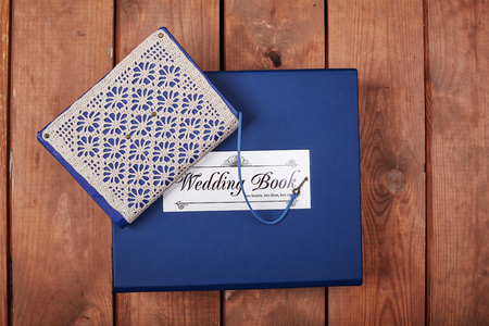 Blank notepad on a wooden surface. Vintage set of object.の写真素材