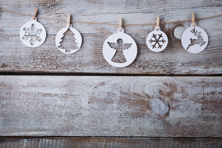 Christmas decorations (snowflake) hanging over wooden background.の写真素材