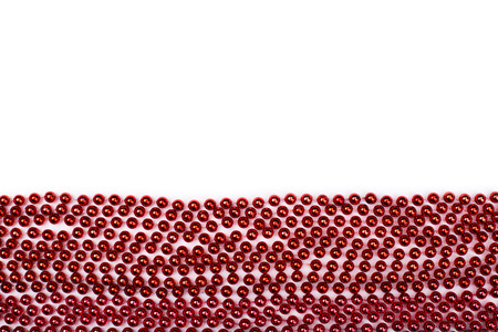 Lines of red beads garland thread isolated on white background.の写真素材