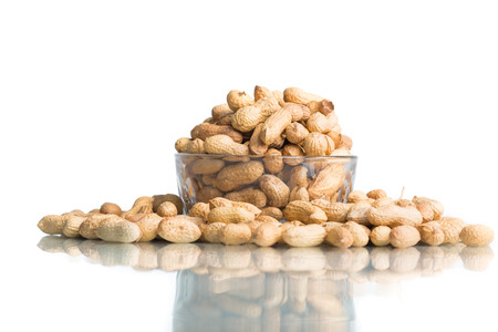 Bowl Of Peanuts Isolated on a white background.